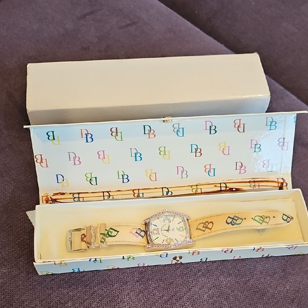 Vintage Dooney & Bourke Beige Watch with Colorful Logo Design